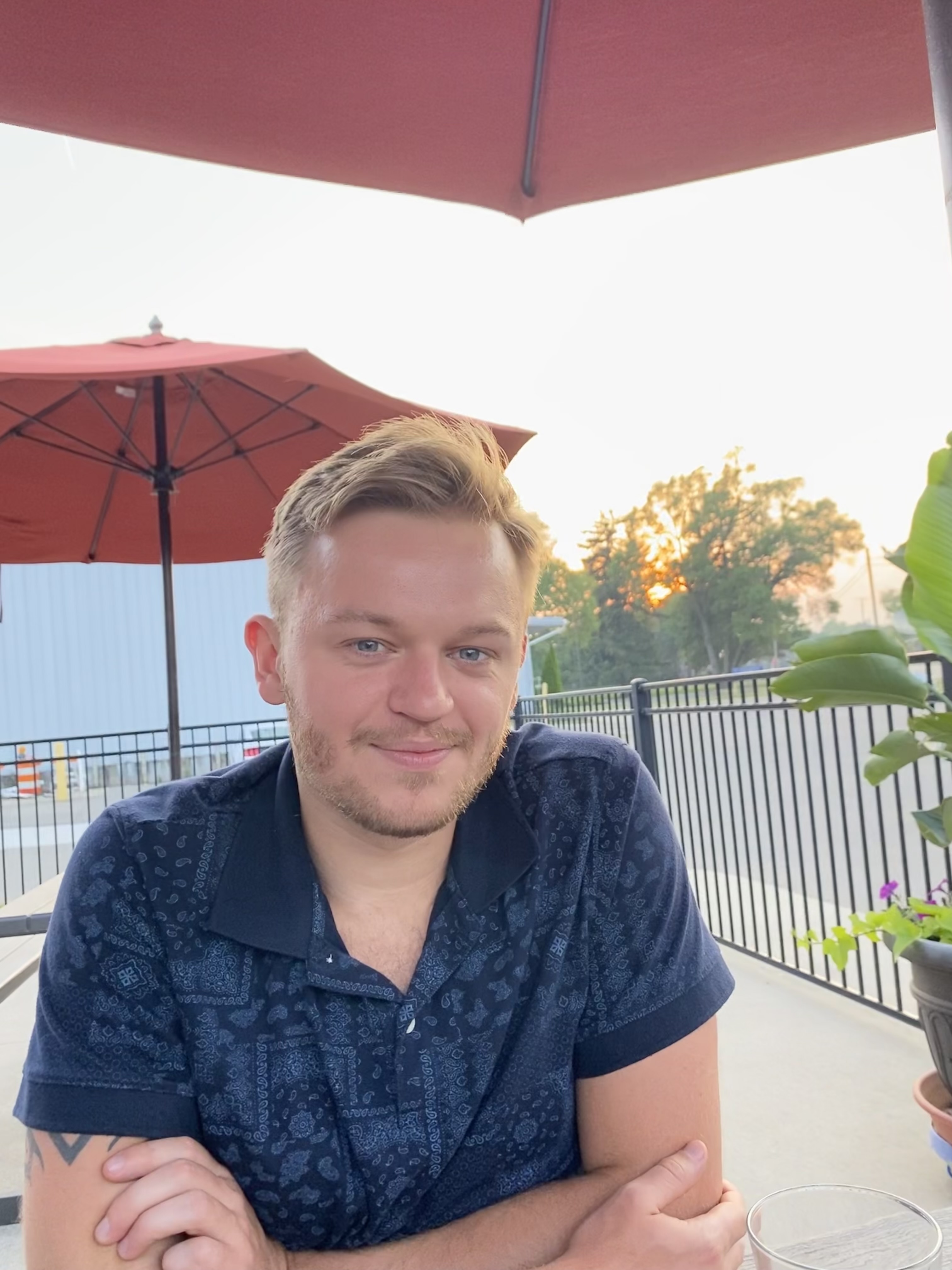 Image of Brett Post smiling at a restaurant table.